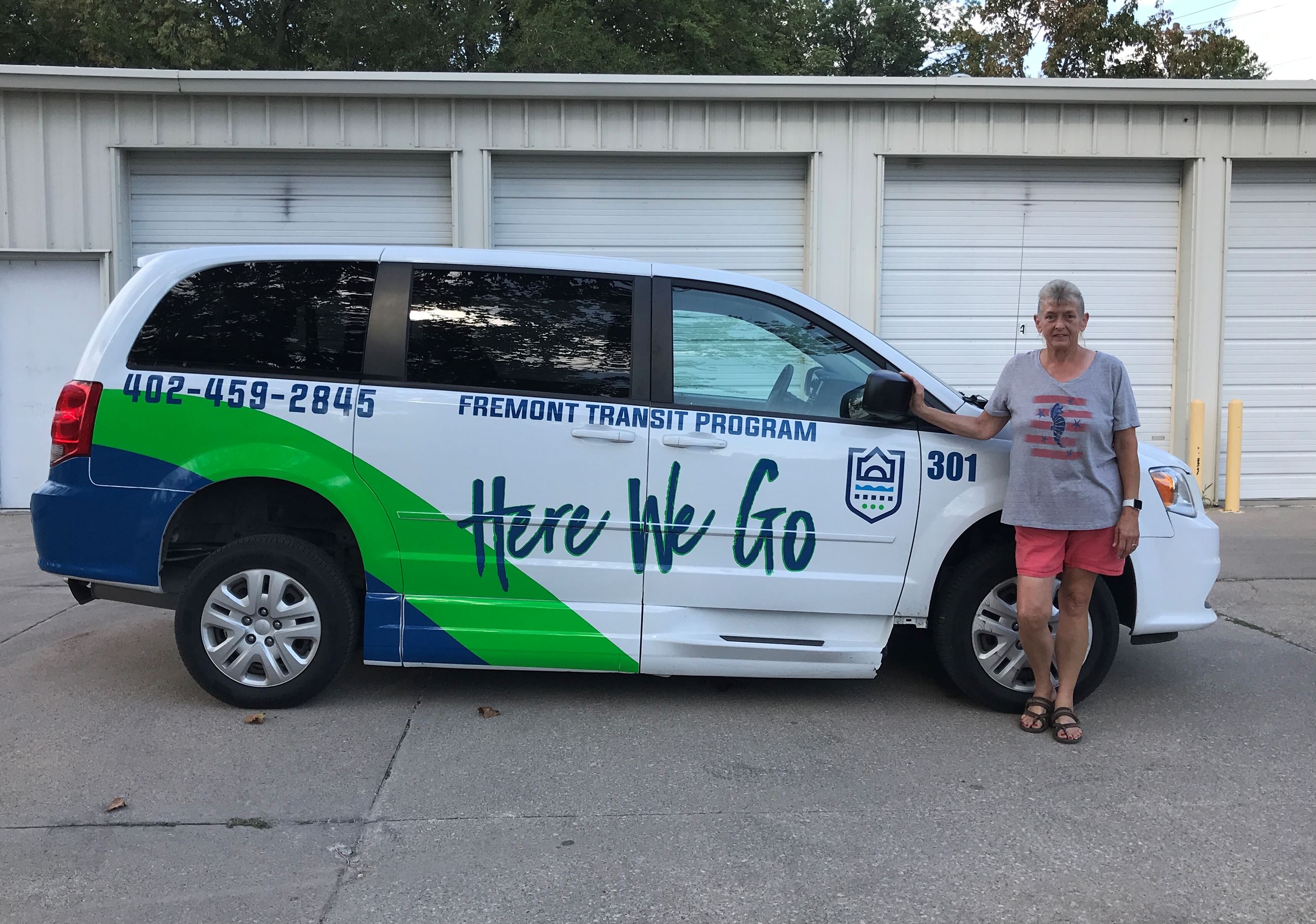 Tammy Nolan, FTP driver stands beside FTP Van
